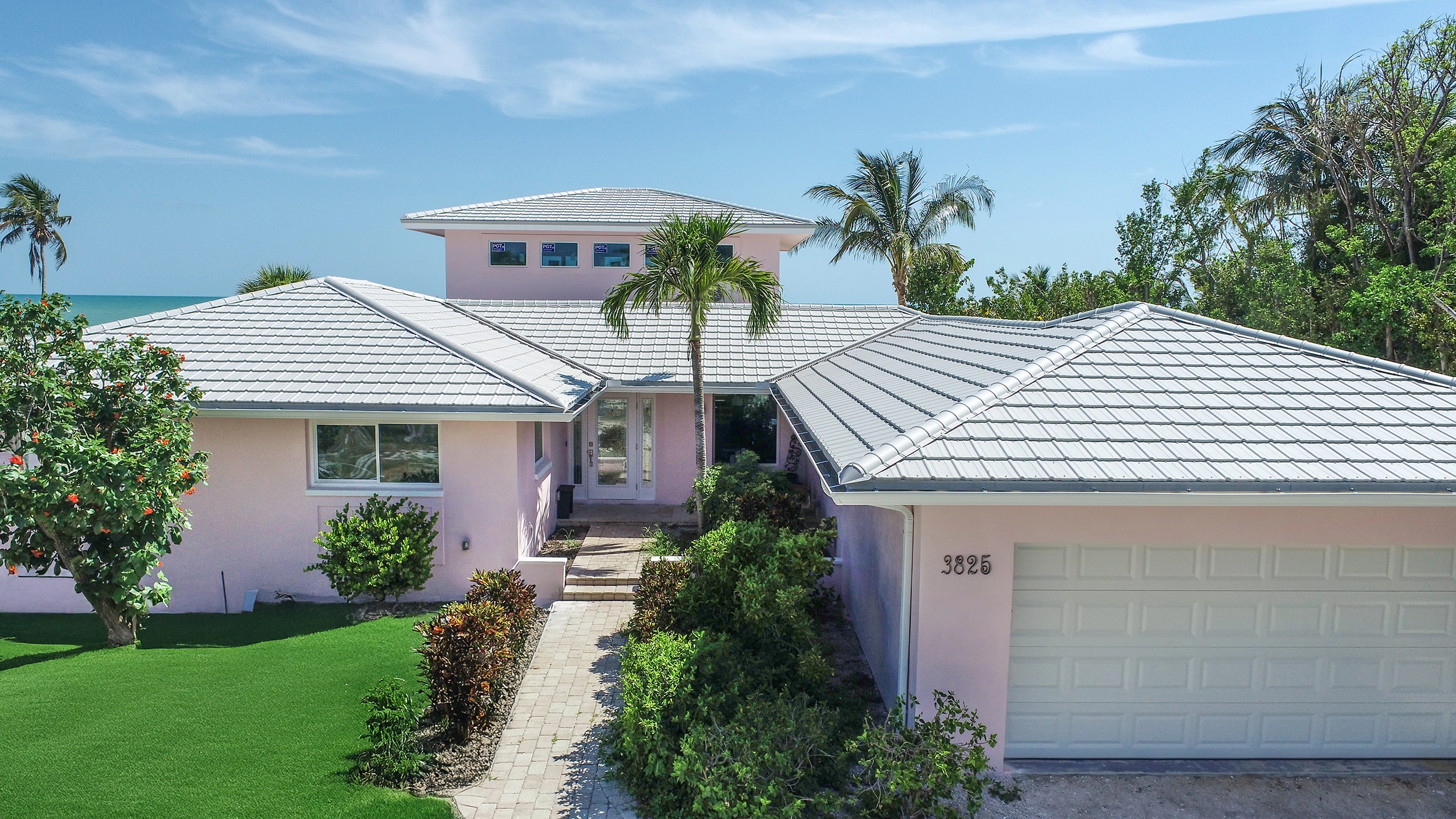 Como Atlantic Sand metal roof — A warm-toned commercial building along the Florida coast.