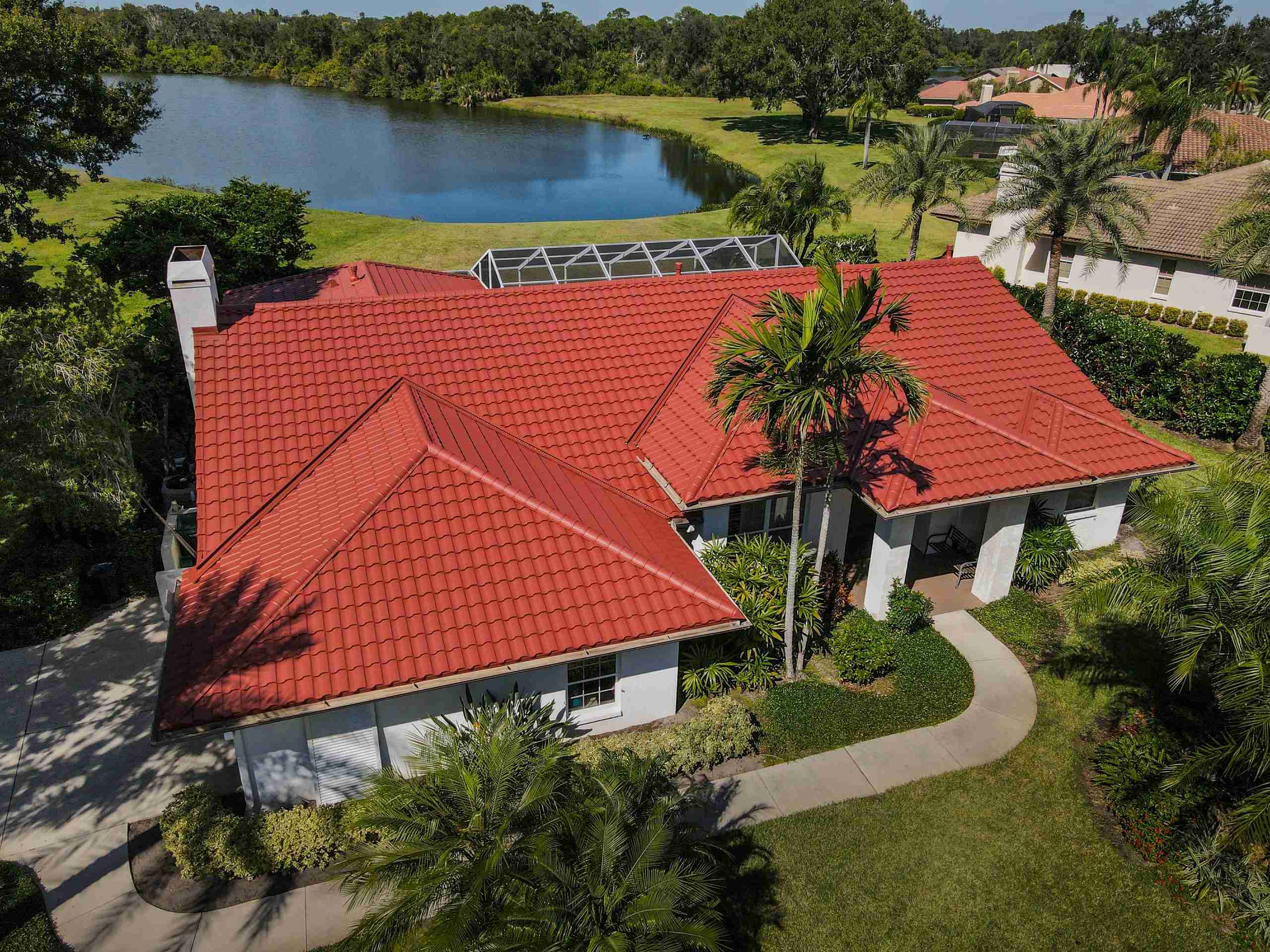 Dura Canyon Red metal roof — A vibrant terracotta roof installed in Sarasota, Florida.
