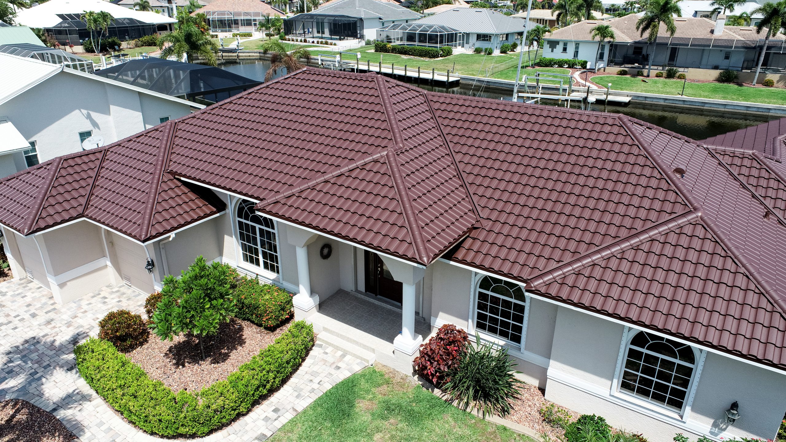 Dura Sierra Brown metal roof — A classic tile-look roof on Brentwood Court, Punta Gorda, Florida.