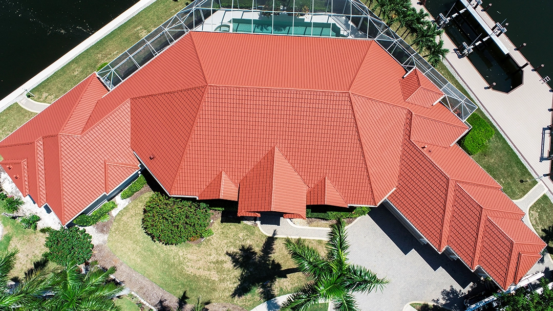Supre Canyon Red metal roof — A luxury waterfront home on Marco Island, Florida.