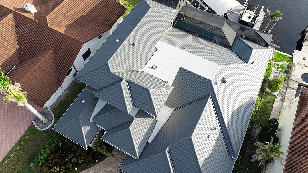Ulta Pacific Grey metal roof — A sleek modern build on SW 57th Terrace, Cape Coral, Florida.